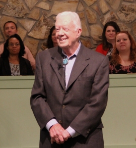 President Carter stands ready to lead a sermon at Sunday church service, as he does still every Sunday.