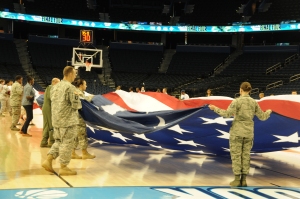 Troops from MacDill Air Force Base in Tampa help with the presentation of the flag during pregame of the National Championship game.