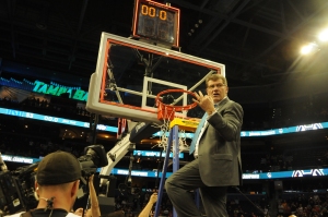 Coach Geno Auriemma cuts down the net as UConn wins its 10th National Championship udner his watch.